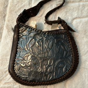 Vintage Fendi oyster shoulder bag. Embossed and pressed metal whipstitch trim.